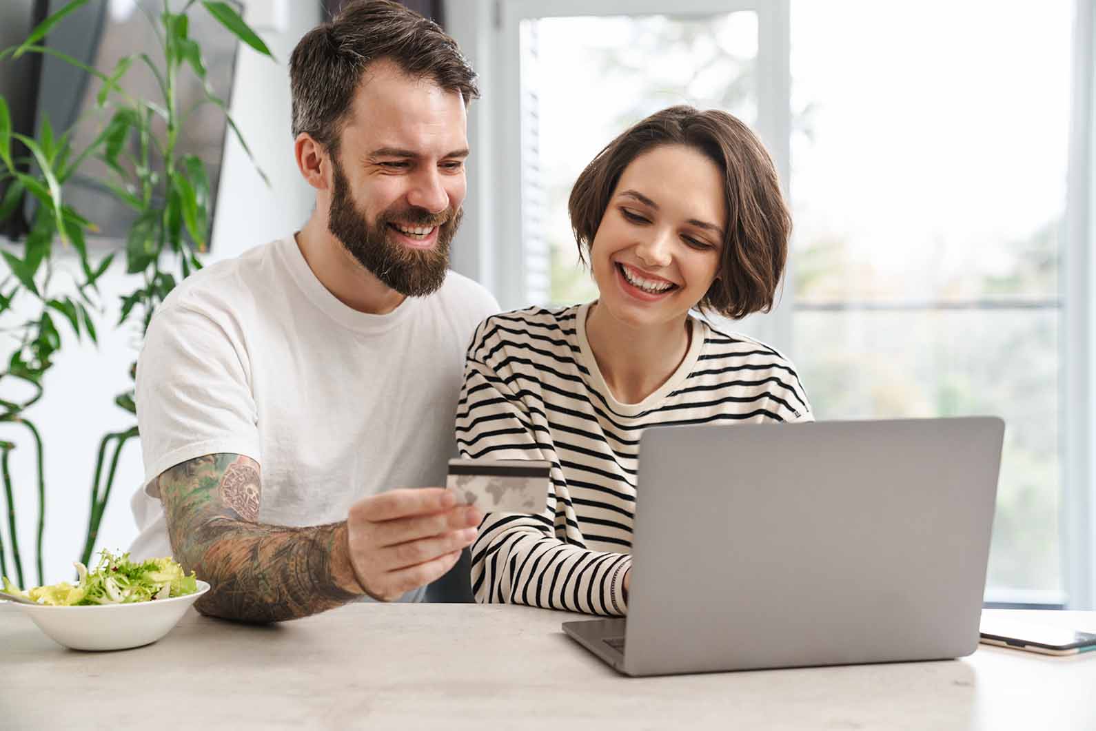 portrait-of-a-cheerful-couple-shopping-online-with-2021-12-15-13-51-22-utcLow